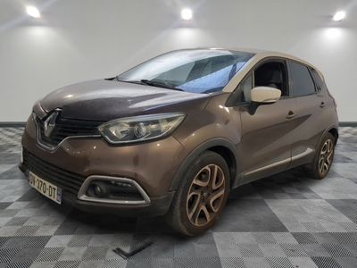the brown car is parked on a checkered floor in the garage
