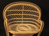 an old wicker chair on a black background with a black background