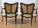pair of antique chairs with upholstered back and arms