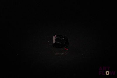 a black box in the middle of a dark room
