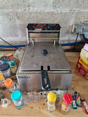 an image of a counter top with a fryer on it