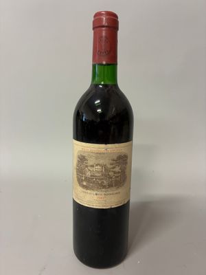a bottle of wine that is sitting on a table