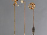 three pairs of gold plated earrings with pearls and a man on a horse