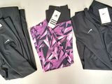 three pairs of women ' s nike leggings with tags on them