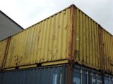 a yellow container sitting on top of a blue container