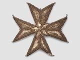 an image of a cross made out of metal
