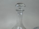 a glass decanter with a glass stopper on it