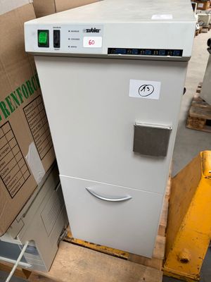 a refrigerator that is sitting on a pallet in a warehouse