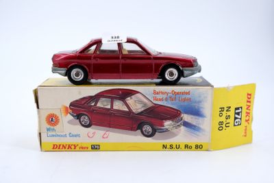 a red toy car sitting on top of a box