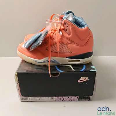 a box that has a pair of shoes on top of it