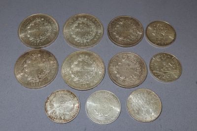 six different types of coins are arranged on a table
