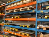 the shelves are full of different types of metal and wood