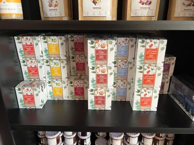 many boxes of food sitting on a shelf in a store