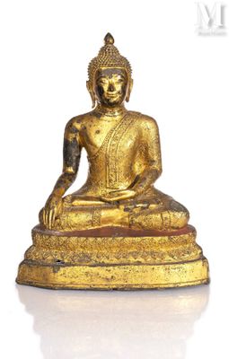 an image of a golden buddha statue sitting on a white surface