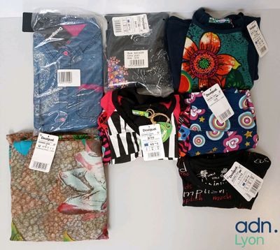 a lot of clothes that are on the table