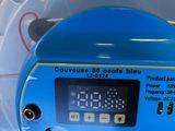 a blue machine with a digital display on it