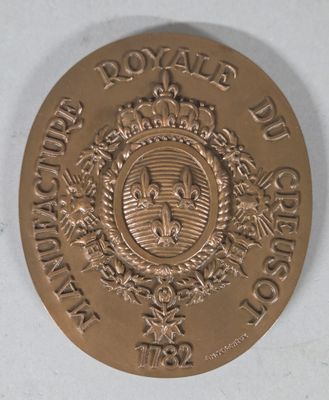 an image of a gold medal with a crown on it