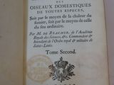 an open book with a picture of a coat of arms on it