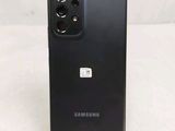 a close up of the back of a black samsung galaxy s20