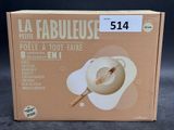 the box is open to show the contents of a bowl and spoon