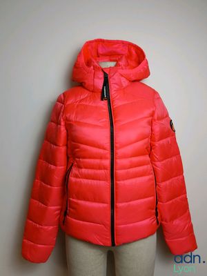 a woman ' s red down jacket on a mannequin mannequin mannequin mannequin mannequin mannequin mannequin manne