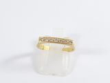 an image of a gold ring with diamonds on it