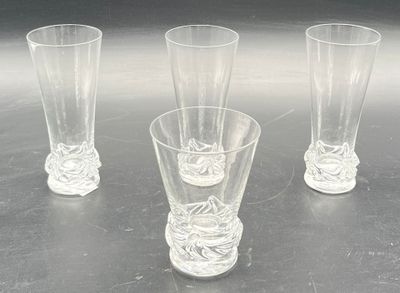 three glasses sitting on a table next to each other