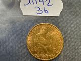 a close up of a gold coin with a label on it