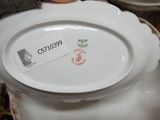 a person holding a white plate with a label on it