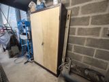 a tall cabinet in the middle of a room