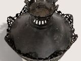 a black and white photo of a lamp with a crown on it