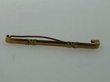 a gold colored tie bar with a knot on it