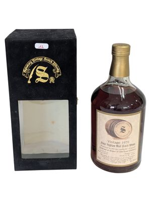 an image of a bottle of whisky sitting next to a box