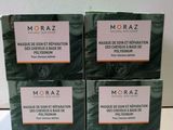 three boxes of moraz soap sitting on top of a table