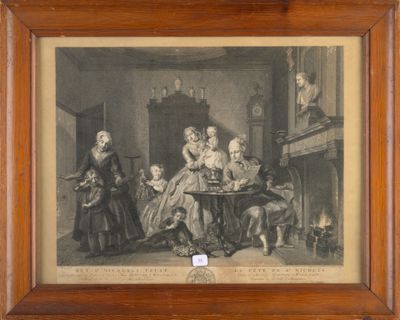 une vieille photo d'une famille réunie autour d'une table