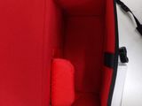 a red box with a red pillow inside of it