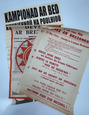 two pamphlets are stacked on top of each other on a table