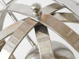 a close up of a metal object on a white surface