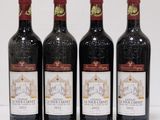 three bottles of wine are lined up on a white surface