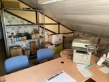 a desk with a printer and a printer on top of it