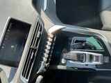 a cell phone in the center of a car