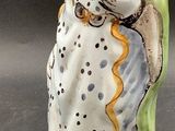 a figurine of a woman holding a baby