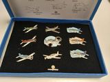 a blue box with a bunch of pins in it