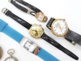 several different types of watches are displayed on a white surface