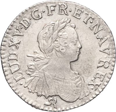 une pièce d'argent portant une tête de femme