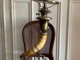 a lamp that is on top of a wicker chair