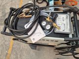 a table with a lot of wires and tools on it