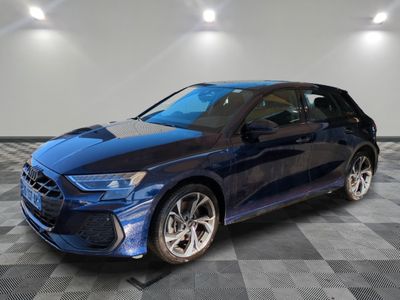 a blue car is parked on a checkered floor in a garage