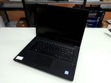 a laptop that is sitting on a table in a room