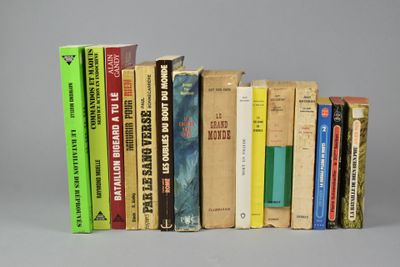 many books that are lined up on a shelf
